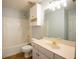 Bathroom with tub/shower combo, toilet and vanity with bright lighting and tile floor at 2875 Factor Walk Blvd, Suwanee, GA 30024