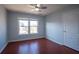Bedroom features hardwood floors, neutral paint, a ceiling fan and plenty of natural light at 2875 Factor Walk Blvd, Suwanee, GA 30024