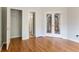 Spacious bedroom featuring hardwood floors, double glass doors and a closet at 2875 Factor Walk Blvd, Suwanee, GA 30024