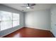 Bedroom featuring hardwood floors, neutral paint, a ceiling fan and plenty of natural light at 2875 Factor Walk Blvd, Suwanee, GA 30024