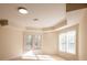 Neutral bedroom features windows and views of the surrounding landscape at 2875 Factor Walk Blvd, Suwanee, GA 30024