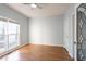 Bright bedroom with hardwood floors, a window, and white trim at 2875 Factor Walk Blvd, Suwanee, GA 30024