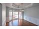 Bright dining room featuring hardwood floors, modern chandelier, and windows for natural light at 2875 Factor Walk Blvd, Suwanee, GA 30024
