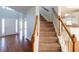 Open entryway featuring a staircase, and hardwood floors at 2875 Factor Walk Blvd, Suwanee, GA 30024