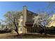 Two-story home with a wooden deck, patio and yard showcasing springtime foliage and flowering trees at 2875 Factor Walk Blvd, Suwanee, GA 30024