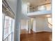 Grand two-story foyer with hardwood floors and staircase leading to the second floor at 2875 Factor Walk Blvd, Suwanee, GA 30024