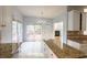Bright kitchen with tile floor and granite countertops featuring exterior access at 2875 Factor Walk Blvd, Suwanee, GA 30024