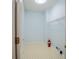 Functional laundry room with tiled floor, shelving and washer hookups at 2875 Factor Walk Blvd, Suwanee, GA 30024