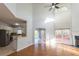 Open-concept living room offering lots of natural light, a fireplace, and kitchen access at 2875 Factor Walk Blvd, Suwanee, GA 30024
