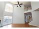 Bright living room featuring high ceilings, lots of windows, and a staircase to second level at 2875 Factor Walk Blvd, Suwanee, GA 30024