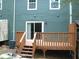 Backyard deck showcasing stairs and entrance to a home with blue siding at 3516 Ashley Station Sw Dr, Marietta, GA 30008