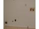 Basement area featuring hookups on a white wall and beige tiled flooring at 3516 Ashley Station Sw Dr, Marietta, GA 30008