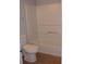Bathroom with white tub/shower combo and toilet, against neutral walls and floor at 3516 Ashley Station Sw Dr, Marietta, GA 30008