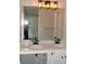 Bathroom vanity with double sinks, stone countertop, and modern lighting at 3516 Ashley Station Sw Dr, Marietta, GA 30008