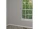 Bedroom corner with view of window and neutral walls at 3516 Ashley Station Sw Dr, Marietta, GA 30008