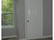 Bedroom showcasing a bright window and a closed door to the living area at 3516 Ashley Station Sw Dr, Marietta, GA 30008