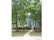 Charming exterior of a home, nestled among mature trees at 3516 Ashley Station Sw Dr, Marietta, GA 30008