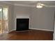 Bright living room featuring hardwood floors, fireplace, and sliding door to deck at 3516 Ashley Station Sw Dr, Marietta, GA 30008