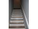 Straight stairway featuring white risers, stained treads, and painted handrail at 3516 Ashley Station Sw Dr, Marietta, GA 30008