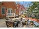 Cozy backyard patio with comfortable seating, a built-in grill, and charming landscaping for relaxing outdoor gatherings at 4045 Stephens Mill Ne Run, Atlanta, GA 30342