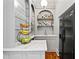 Stylish bar area with marble countertops, custom cabinetry, and built-in shelving for beverages at 4045 Stephens Mill Ne Run, Atlanta, GA 30342