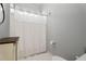 Simple bathroom featuring a shower with curtain, vanity, and toilet at 4045 Stephens Mill Ne Run, Atlanta, GA 30342