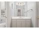 Bright bathroom features a white vanity with sink, cabinet storage, and a framed mirror at 4045 Stephens Mill Ne Run, Atlanta, GA 30342