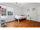 A charming bedroom with hardwood floors, bright natural light, and neutral wall color at 4045 Stephens Mill Ne Run, Atlanta, GA 30342