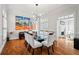 Elegant dining room with a modern chandelier, glass table and art at 4045 Stephens Mill Ne Run, Atlanta, GA 30342