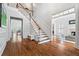 Grand foyer with hardwood floors, staircase, and open doorways to adjacent living spaces creates a welcoming entrance at 4045 Stephens Mill Ne Run, Atlanta, GA 30342