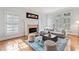 Elegant living room with fireplace, plantation shutters and neutral decor at 4045 Stephens Mill Ne Run, Atlanta, GA 30342