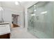 Spacious primary bathroom featuring a large glass shower, double vanities, and marble countertops at 4045 Stephens Mill Ne Run, Atlanta, GA 30342