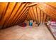Spacious attic with wood beams, offering ample storage and potential for future expansion at 1864 Crestridge Ne Pl, Atlanta, GA 30345
