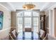 Formal dining room with hardwood floors, recessed lights and modern lighting fixture at 1864 Crestridge Ne Pl, Atlanta, GA 30345