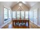 Bright dining room features hardwood floors, large windows, and a modern chandelier at 1864 Crestridge Ne Pl, Atlanta, GA 30345