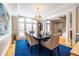 Formal dining room featuring hardwood floors, a large window, and elegant lighting at 1864 Crestridge Ne Pl, Atlanta, GA 30345