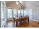 Bright dining room features hardwood floors, large windows, and a modern chandelier at 1864 Crestridge Ne Pl, Atlanta, GA 30345