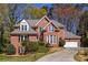 Charming two-story brick home with a well-manicured lawn and attached two car garage at 1864 Crestridge Ne Pl, Atlanta, GA 30345