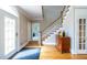 Inviting foyer with hardwood floors, staircase, and stylish console table at 1864 Crestridge Ne Pl, Atlanta, GA 30345