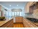 Well-equipped kitchen with granite counters, light wood cabinets, and stainless appliances at 1864 Crestridge Ne Pl, Atlanta, GA 30345