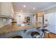 Kitchen with granite countertops, bar seating, stainless steel appliances, and tile backsplash at 1864 Crestridge Ne Pl, Atlanta, GA 30345
