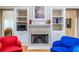 Cozy living room fireplace with built in book shelves and stylish décor at 1864 Crestridge Ne Pl, Atlanta, GA 30345