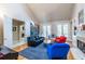 Bright living room with hardwood floors, fireplace, and French doors at 1864 Crestridge Ne Pl, Atlanta, GA 30345