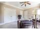 Cozy living room with plush seating, neutral walls, and ample closet space at 1864 Crestridge Ne Pl, Atlanta, GA 30345