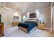 Large main bedroom featuring tray ceilings, dual nightstands, and expansive windows for natural light at 1864 Crestridge Ne Pl, Atlanta, GA 30345