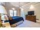Comfortable main bedroom with tray ceiling, plush carpeting, and a door leading to a private balcony at 1864 Crestridge Ne Pl, Atlanta, GA 30345