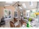Relaxing sunroom with ample seating, skylights, tile floors, and multiple points of entry to the outdoors at 1864 Crestridge Ne Pl, Atlanta, GA 30345