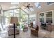 Bright sunroom filled with natural light through large windows, skylights, comfortable seating, and tiled floors at 1864 Crestridge Ne Pl, Atlanta, GA 30345