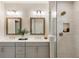 Modern bathroom with double sinks, a glass-enclosed shower, and modern fixtures at 2068 Cortland Rd, Milton, GA 30009
