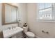Powder room with pedestal sink, and modern fixtures at 2068 Cortland Rd, Milton, GA 30009